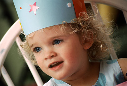 Little girl in birthday hat